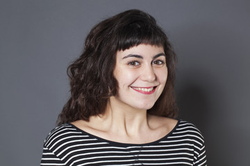 Fototapeta premium portrait of cute 20s brunette girl with natural smile