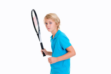  boy with tennis racket in front of white background