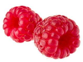 ripe raspberries isolated on white background close up © Natika