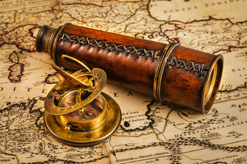 Old vintage compass on ancient map