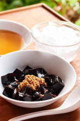 grass jelly dessert, herbal gelatin, Chinese style.