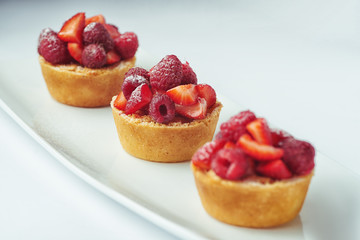 beautiful cake dessert with cream and berry 
