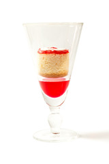 Butter cupcakes and sweet dring in clear glass.