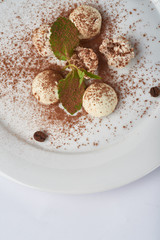 candy hand cooking on a white plate