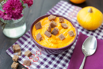 Pumpkin cream-soup with seeds in a bowl