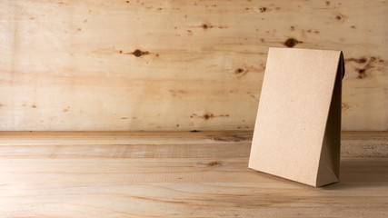 paper bag on wooden background