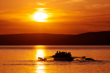 Rowing boat at sunset on Balaton lake