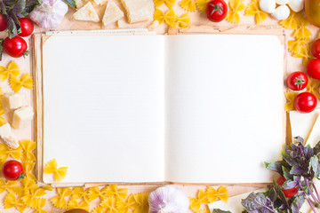Old blank recipe book with italian food ingredients