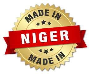 made in Niger gold badge with red ribbon