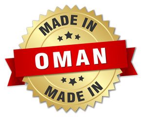 made in Oman gold badge with red ribbon