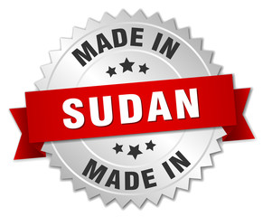 made in Sudan silver badge with red ribbon