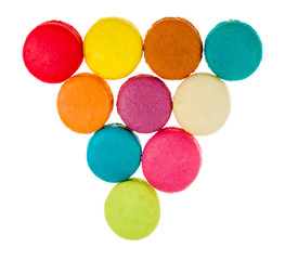 Colorful macarons on white background. Macaron or Macaroon is sw