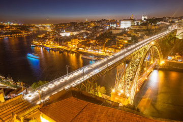 Fototapeta na wymiar Panorama of lighted famous bridge Ponte dom Luis above Old town