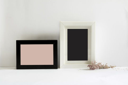 empty picture frames, decorated with pink flowers