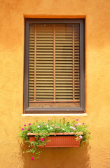 Fototapeta na wymiar close glass window on orange wall