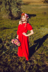 Girl in the Red Dress is Walking on the Field