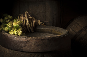 Still life with a keg of beer and hops.