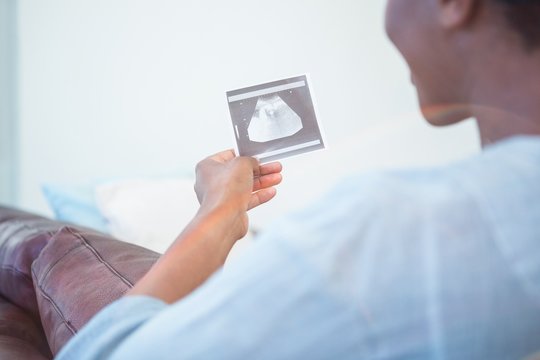 Woman looking at an ultrasound picture