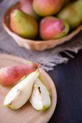 Juicy pears on a rustic wooden kitchen table