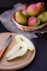 Juicy pears on a rustic wooden kitchen table