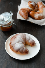 delicious breakfast with fresh croissants and jam