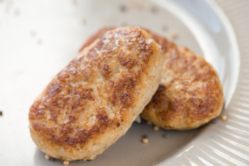 homemade fish cutlets (cakes)on plate (close up)