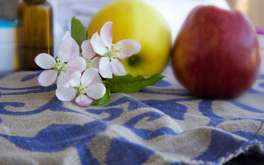 Apple blossoms with green leaves
