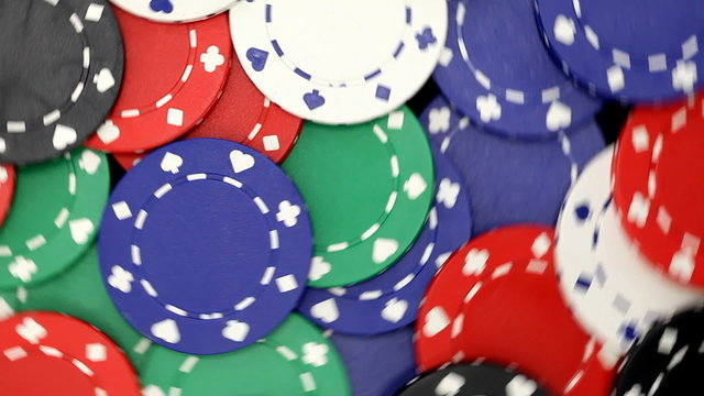 Colorful blank casino chips rotating