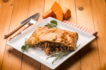 strudel stuffed with chopped meat pumpkin and herbs