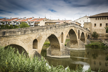 Fototapeta premium ancient Roman bridge over Arga river in Puente la Reina - Gares, Spain