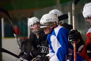 Fototapeta premium ice hockey players on bench