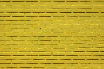 Fototapeta premium Yellow brick wall texture.