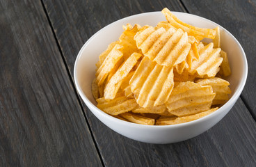 potato chips on wood background