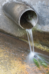 Water Pouring From Pipe Pollution