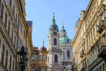 Fototapeta na wymiar Saint Nicholas Cathedral in the end of Bridge Street, Prague.