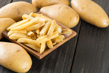 french fries on wood background