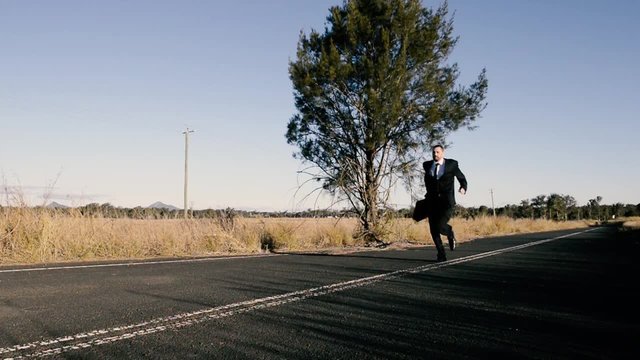 Concept: A frustrated business man is leaving the corporate lifestyle and chasing freedom in the outback of Queensland, Australia. Cinematic Portrait Style.