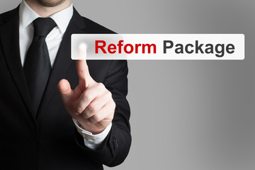 businessman pushing flat button reform package