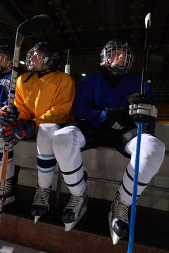 ice hockey players on bench