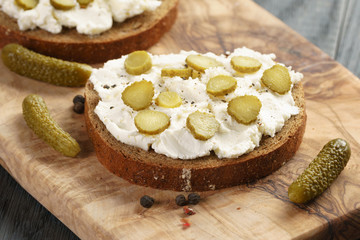 sandwiches with rye bread, cream cheese and marinated cucumbers