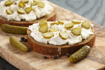 sandwiches with rye bread, cream cheese and marinated cucumbers
