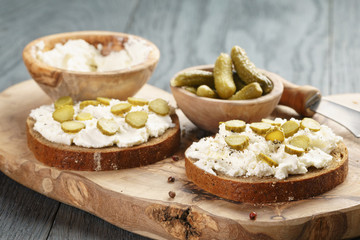 sandwiches with rye bread, cream cheese and marinated cucumbers
