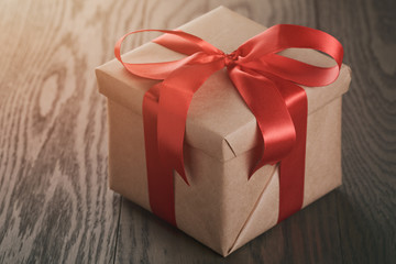 rustic gift box with red ribbon bow