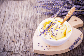 Herbal butter for breakfast with lavender flowers in a white ceramic cup