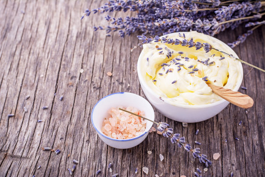 Herbal butter for breakfast with lavender flowers in a white ceramic cup