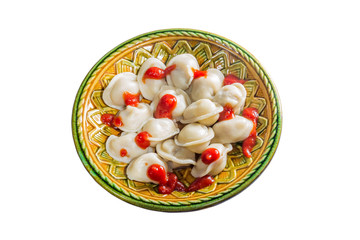 full ketchup pelmeni on a white background