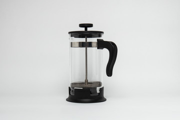 French press pot coffee maker filled with the ground coffee, com