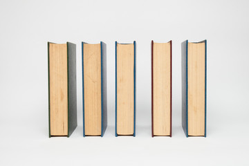 books in a row, isolated on white background