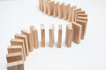 Domino effect - row of white dominoes on white background