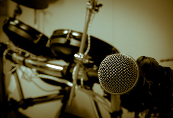 Microphone on blur drum background.